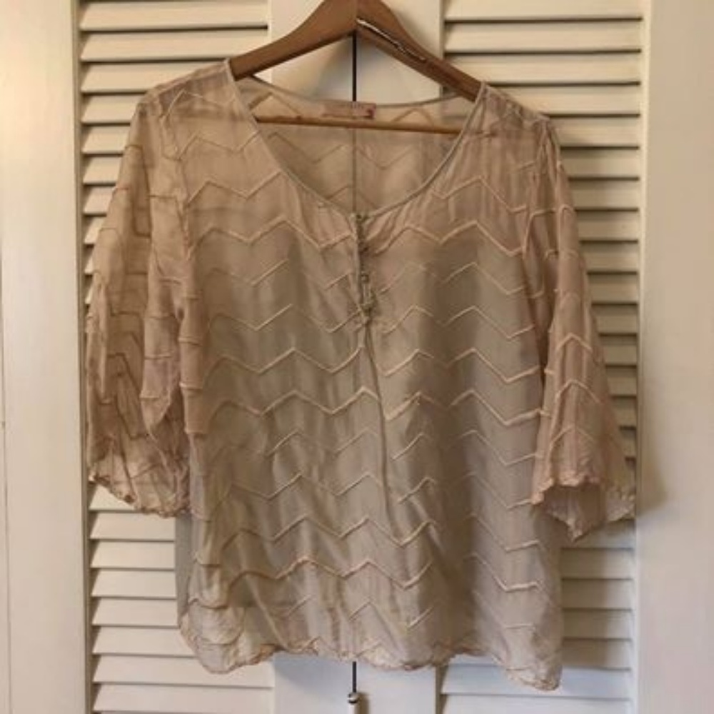 Nude blouse with 3/4 inch sleeves